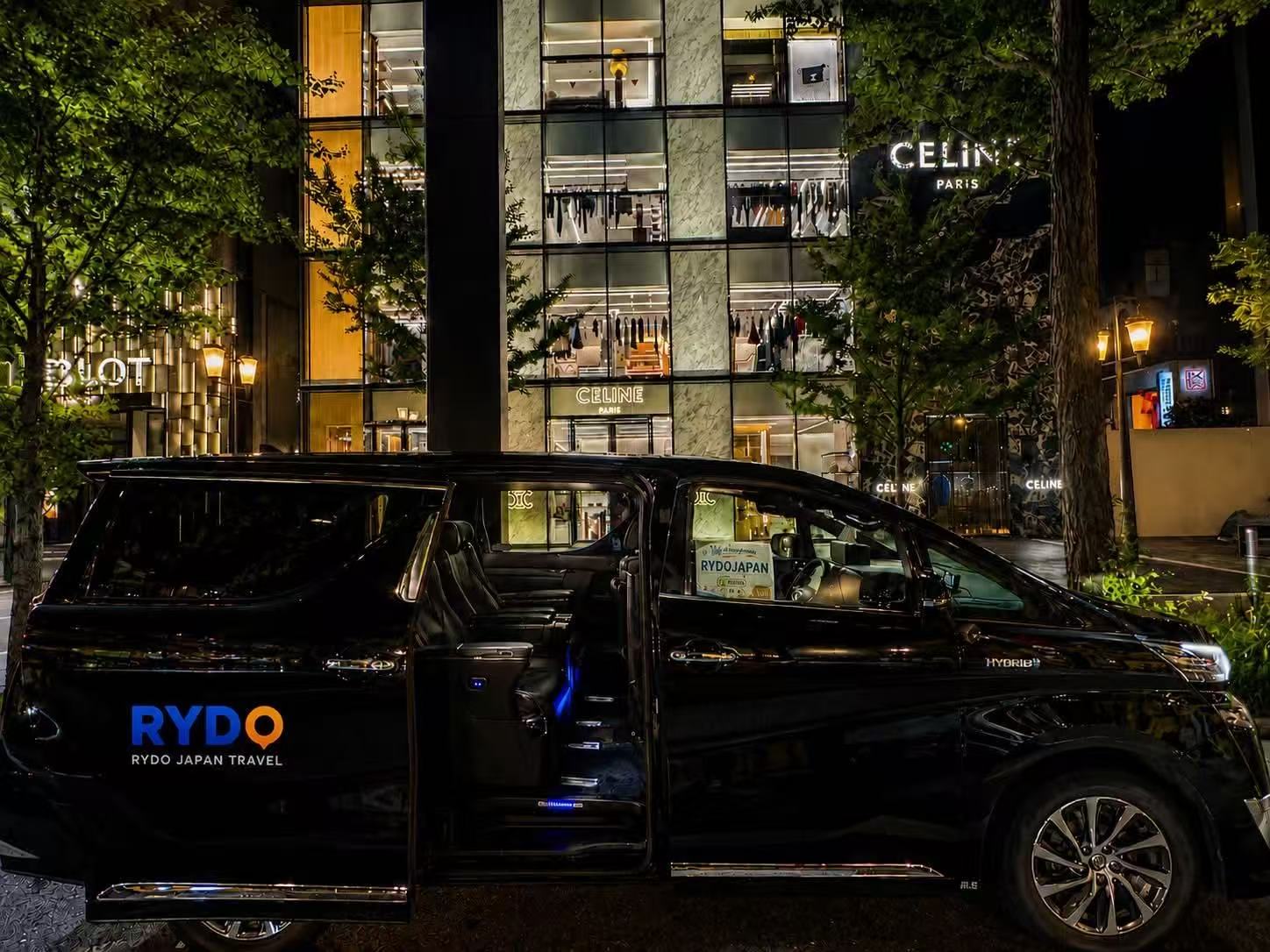 Rydo Japan black Toyota Alphard at night with its sliding door open